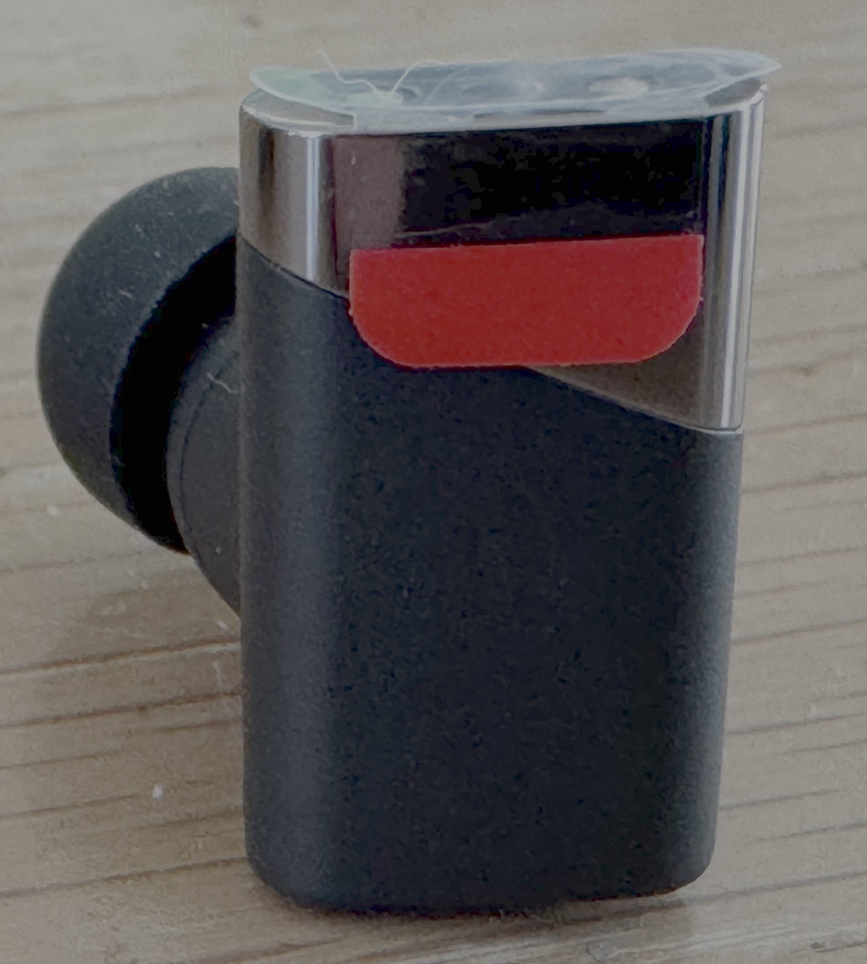 Earbuds out of case with protective plastic