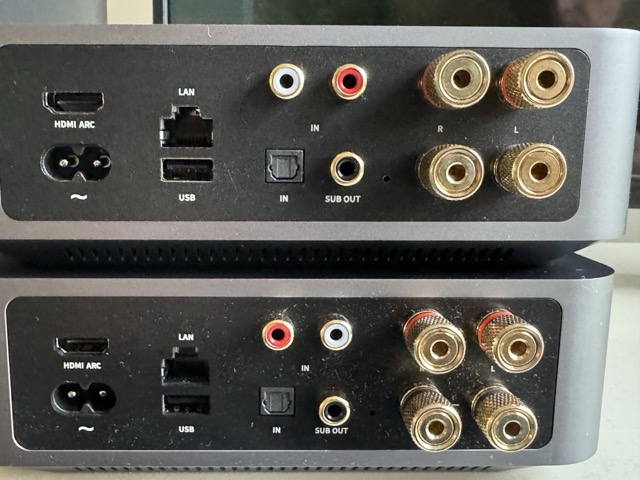 the WiiM Amp rear panel — HDMI ARC, Ethernet, USB, optical and RCA inputs, a subwoofer output and gold-plated speaker binding posts