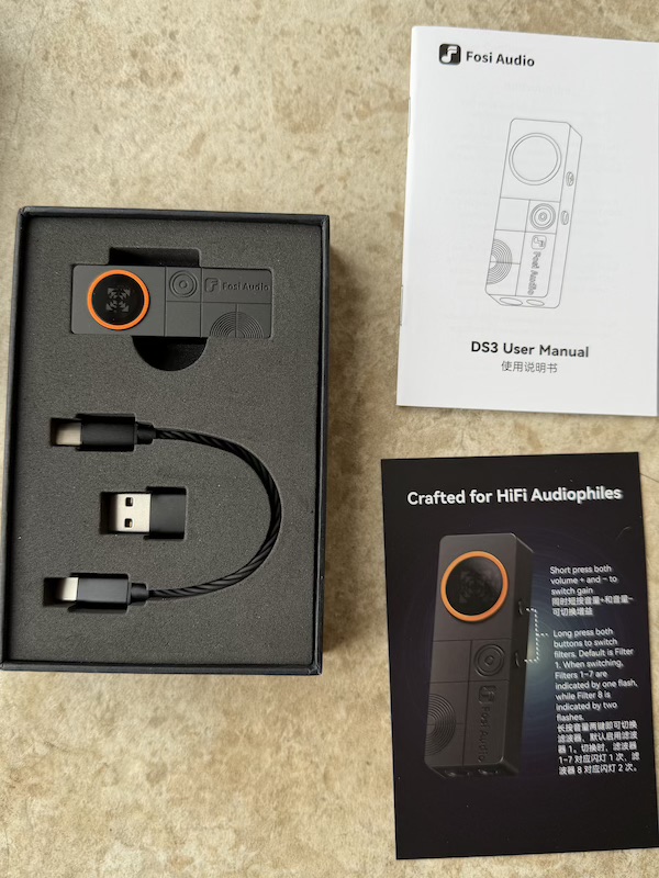 Opening the box reveals manual and guide