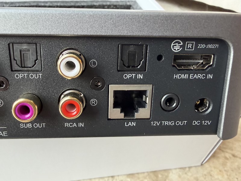 back connections — HDMI, LAN, optical, sub, trigger, RCA in