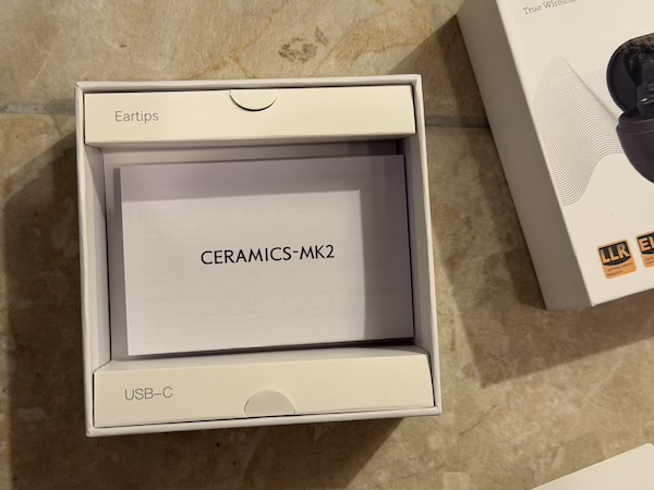 tray lifted to reveal manual underneath