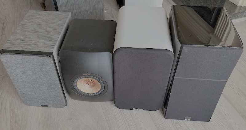 next to a larger bookshelf speaker