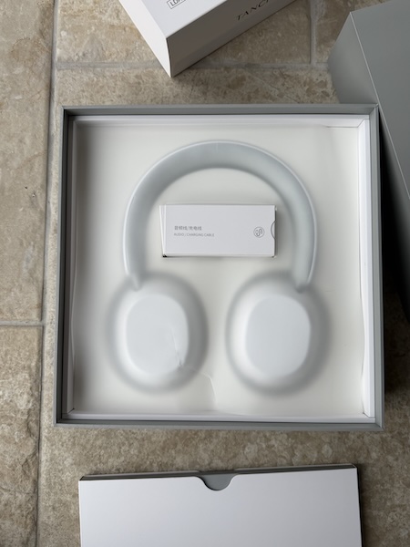 opening the box — Rita visible under protective film