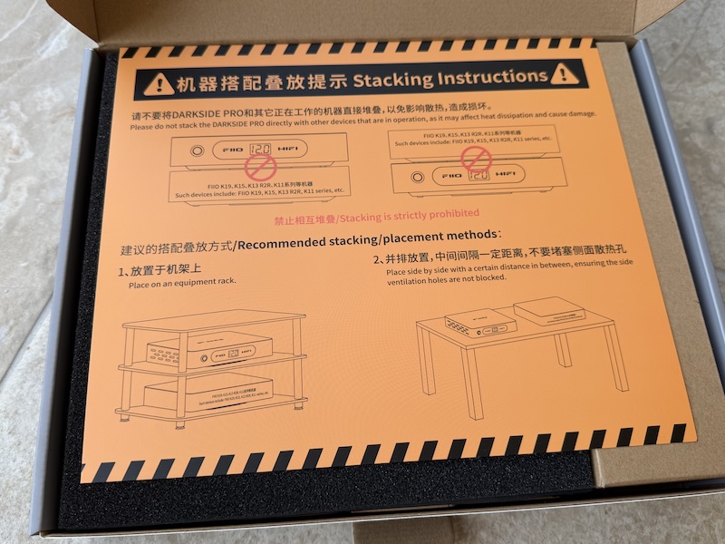 open box with insert showing heat warning and hifi rack recommendation