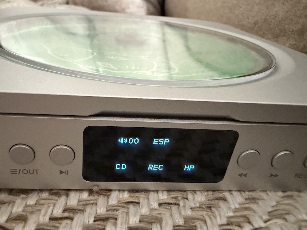 the merak playing a CD — the OLED display and tray mechanism in operation