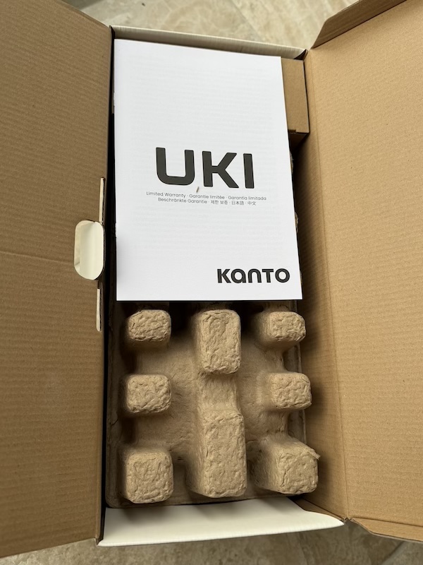 Open box with manual on top