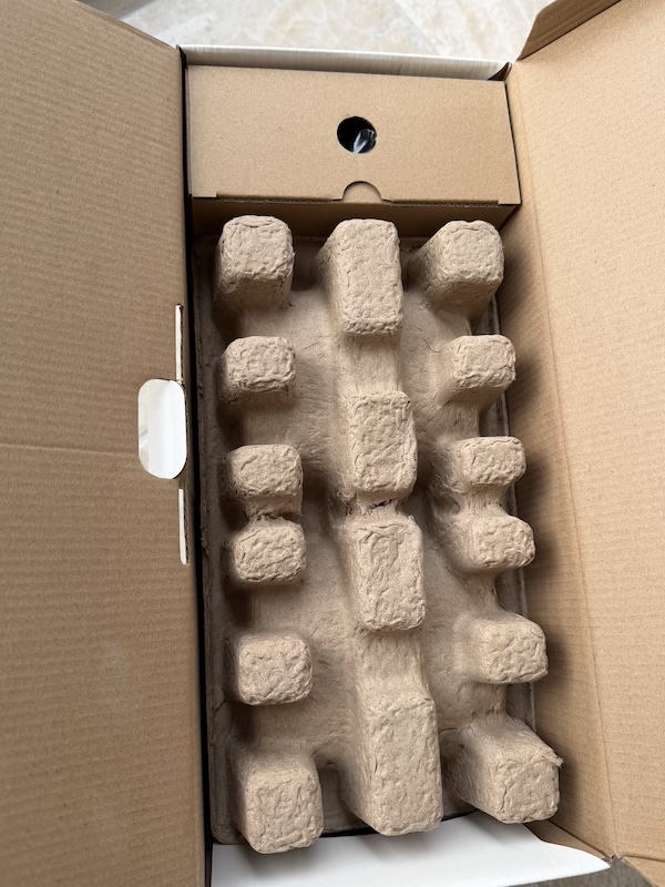 Protective cardboard and accessories box visible