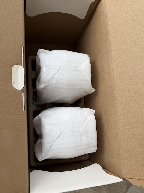 Speakers under cardboard protection in covers