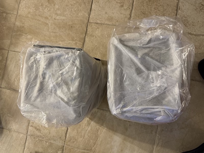 both speakers in protective packaging