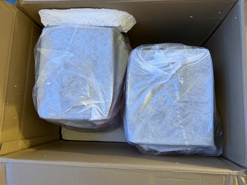 open box showing the interesting offset placement of both speakers