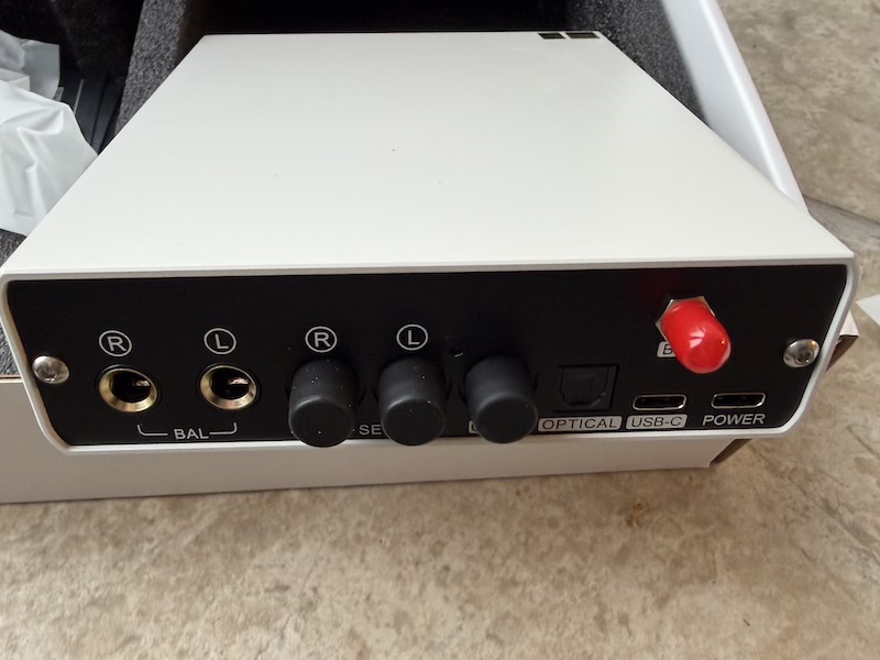 rear panel showing balanced TRS and RCA outputs alongside all digital inputs, Bluetooth connector, and power