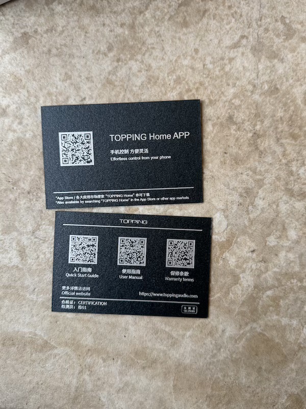 the two included information cards with app QR codes and manual links