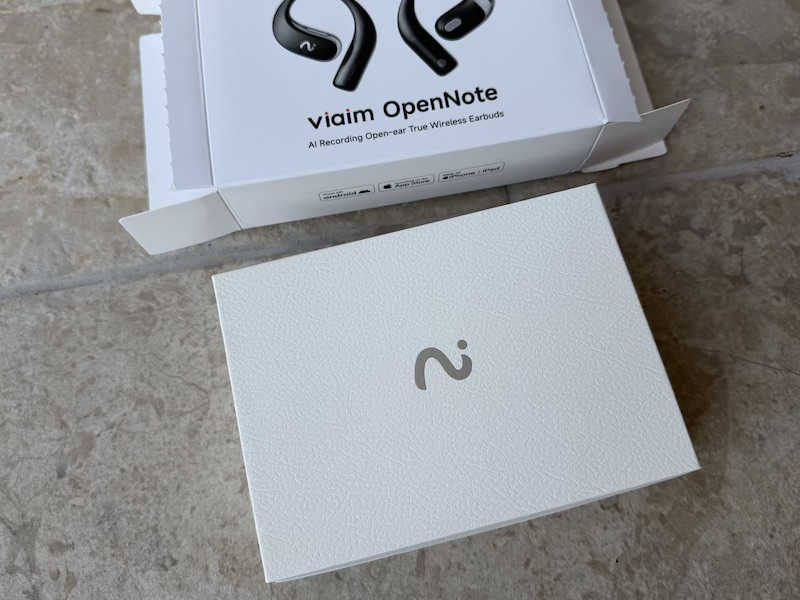 opening the outer box to reveal the inner presentation box