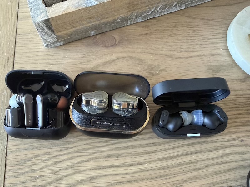 three cases open — EarFun Air Pro 4, H3, Status Pro X