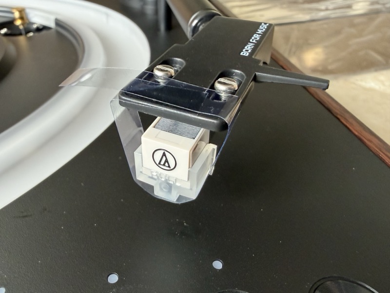 tonearm secured with a protective film