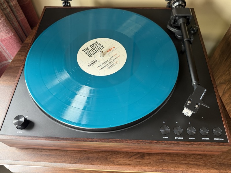 tt11 playing vinyl in the retro setup wooden cabinet