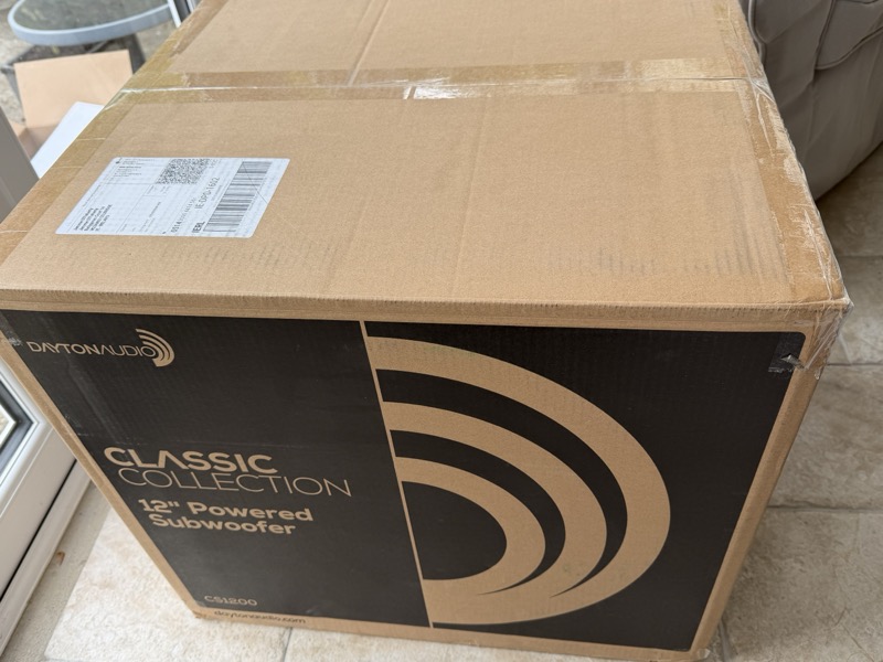 the outer shipping carton, printed with the Classic Collection branding and “12" Powered Subwoofer”
