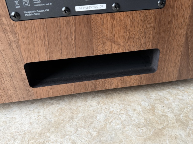 a close-up of the slot-loaded bass port