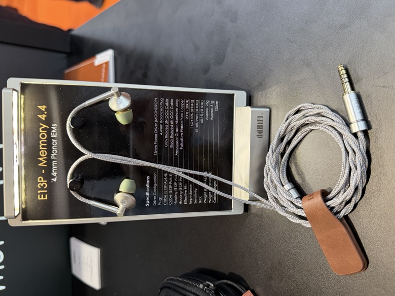 ddHiFi’s Vienna High End show display card, with the AL4.4 specification sheet and a coiled cable
