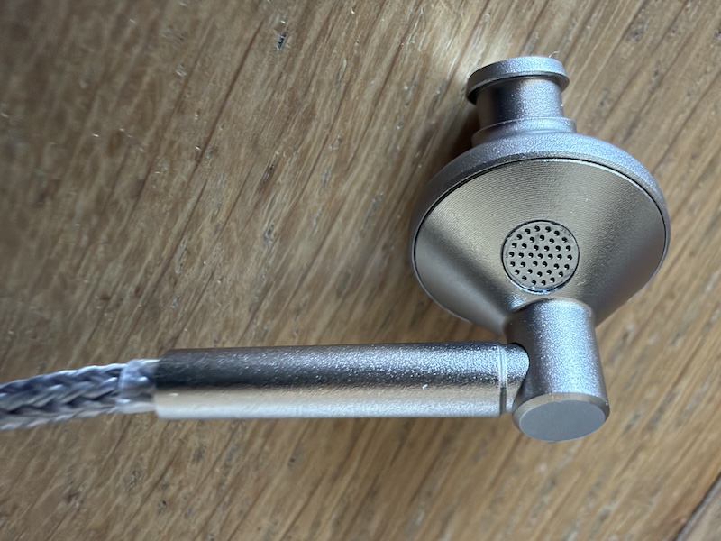 angled view of the earpiece faceplate showing the vent grille