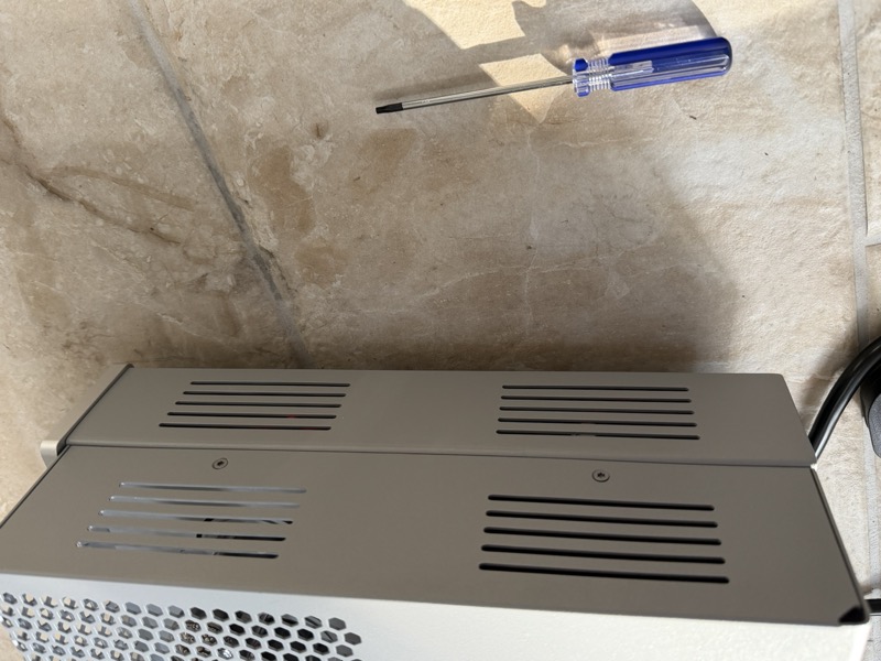 amplifier side panel screws and the supplied screwdriver