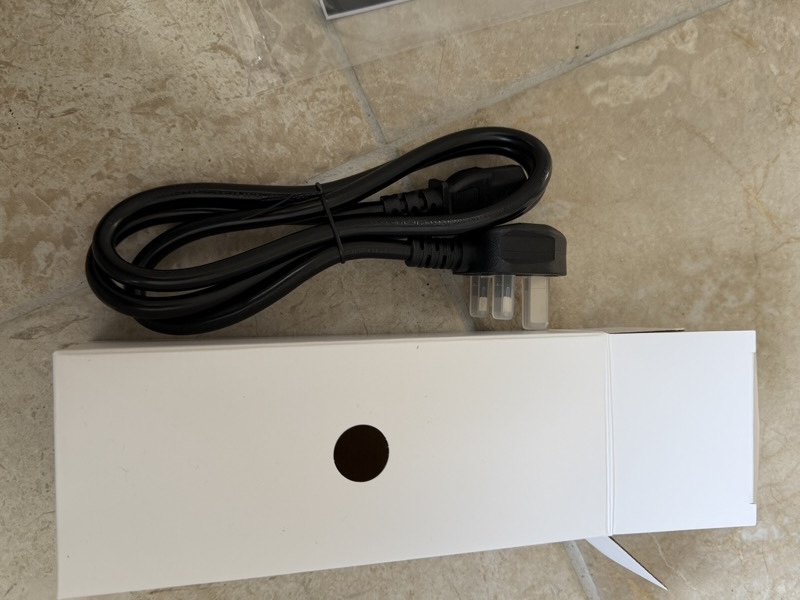 white box with black usb cable