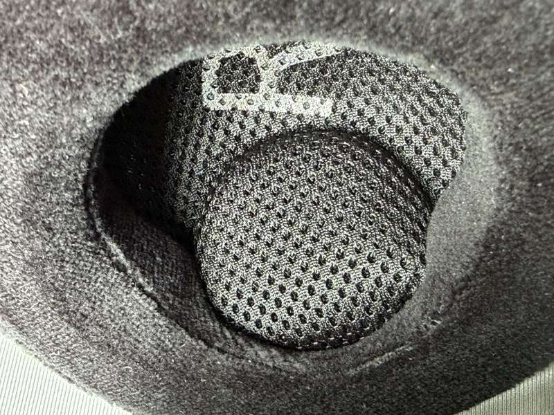 looking into the earpad at the driver mesh, with the R channel marking visible