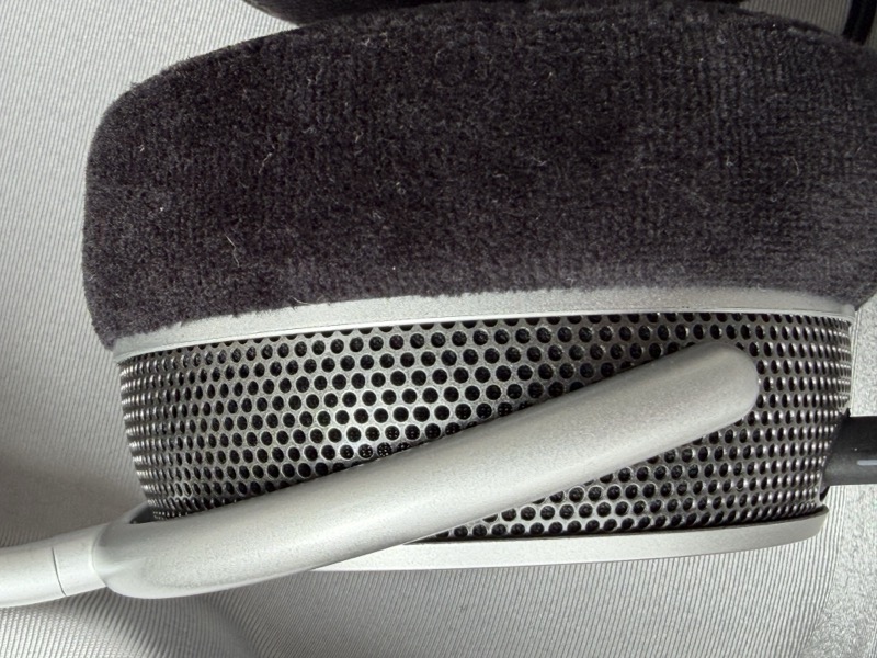 the earcup grille seen in profile against the velour earpad