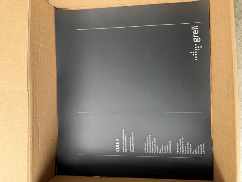 the manual cover, printed in the same dark minimal style as the box
