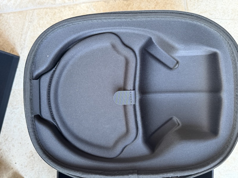 the case interior with the two moulded compartments for headphone and accessories