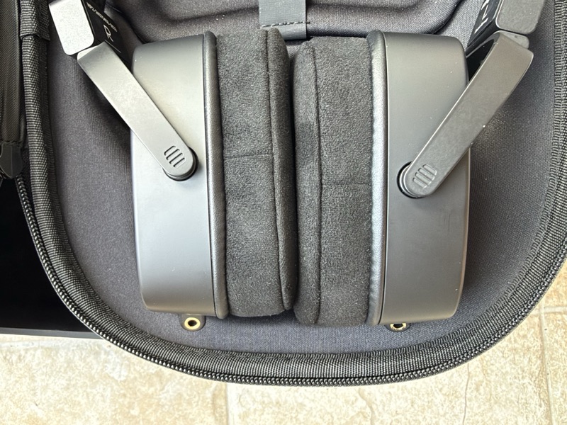 the earcups folded and stacked in the case