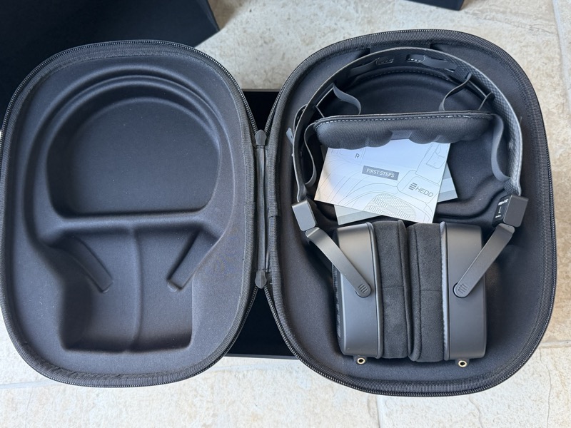 the headphone in its case, earcups folded flat