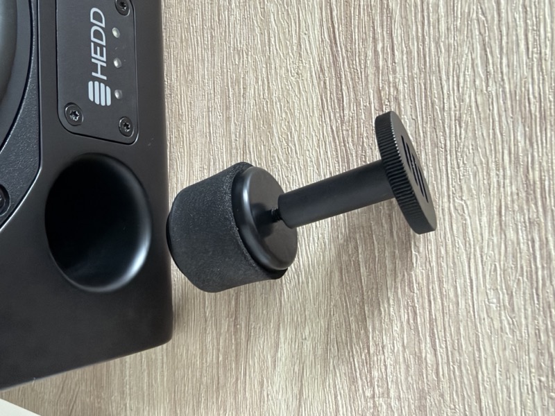 the supplied tool beside the open bass port