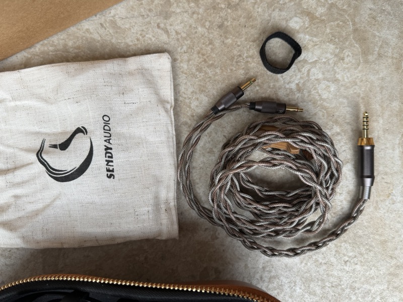 the cable, adapters, and cable tie laid out alongside the accessory bag