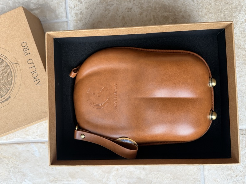 the leather carrying case nested in the box
