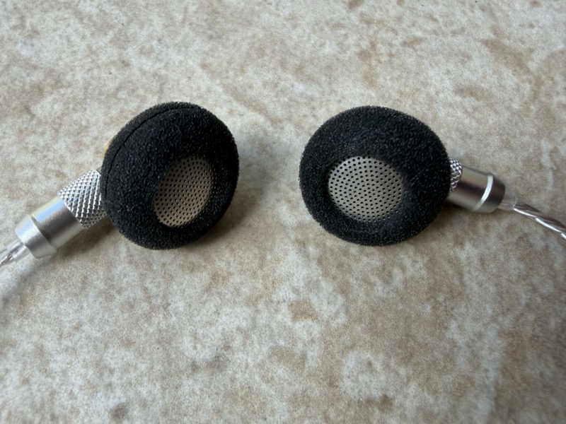 earbud pair with foam and grille