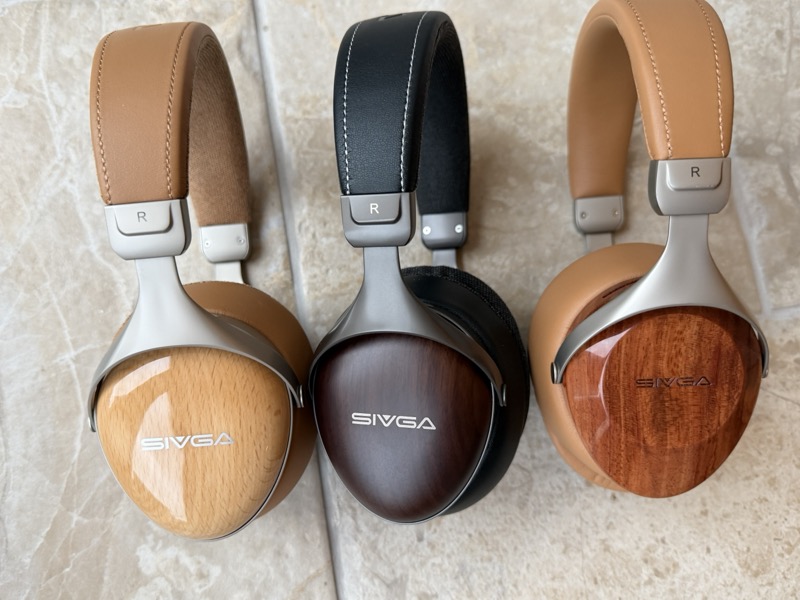 three sivga headphones showing the different wood finishes and headbands