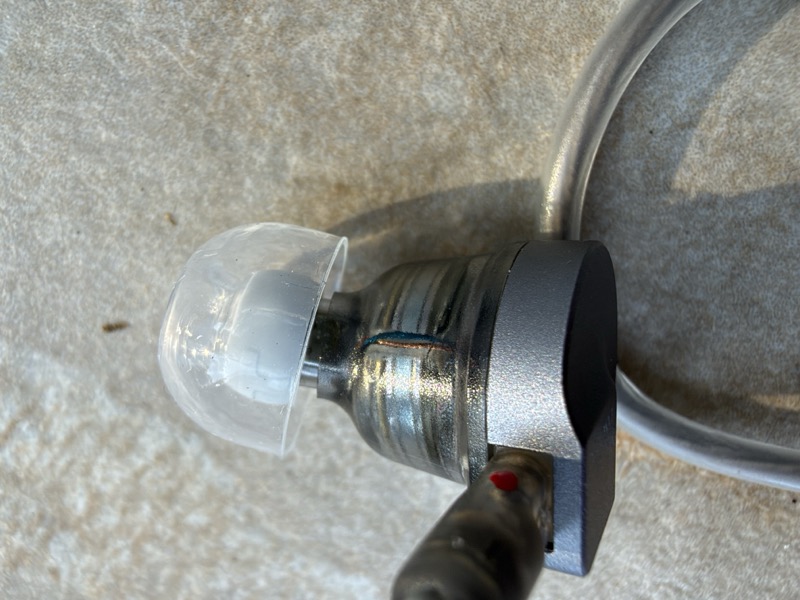 closeup of the nozzle and tip fitted, with the red channel marker visible