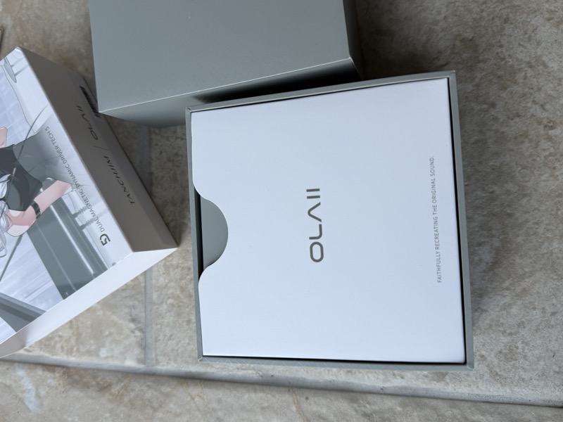 the nested OLAII box pulled partway out of its sleeve