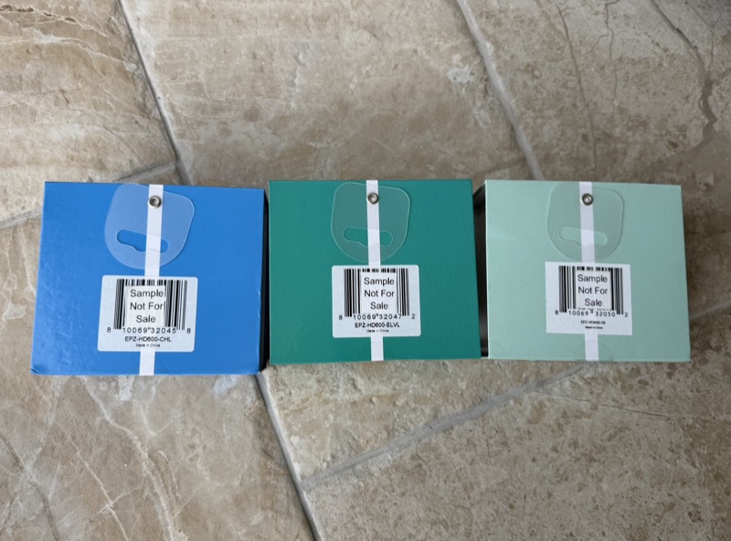 rear of the three boxes showing hang tabs and sample not for sale barcode labels