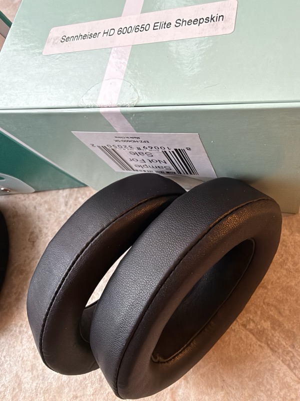 elite sheepskin pads at an angle showing fine grain and the thick foam profile