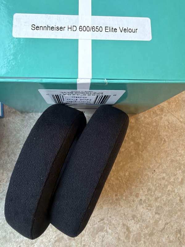 elite velour pads leaning against the dark green elite box