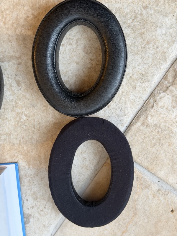 dekoni leather pad above the stock hd600 velour pad, compared from above for aperture size and shape
