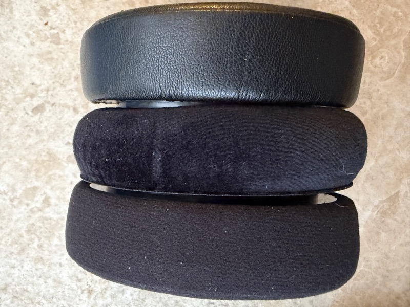 dekoni leather pad, dekoni velour pad and stock hd600 velour pad stacked to compare thickness