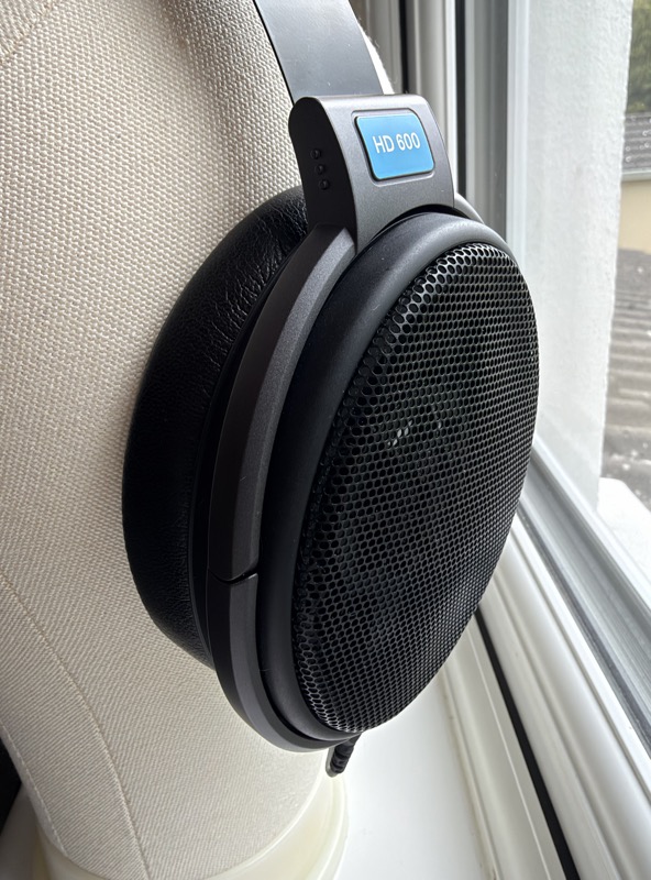 close side view of an hd600 earcup with a dekoni leather pad fitted, hd 600 badge visible