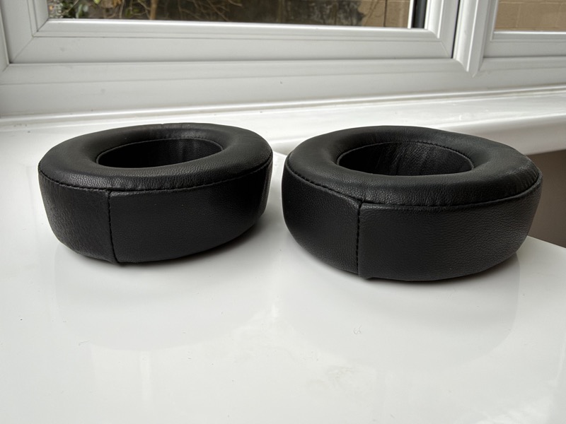 a pair of dekoni leather pads off the headphone, showing depth and the smooth inner wall