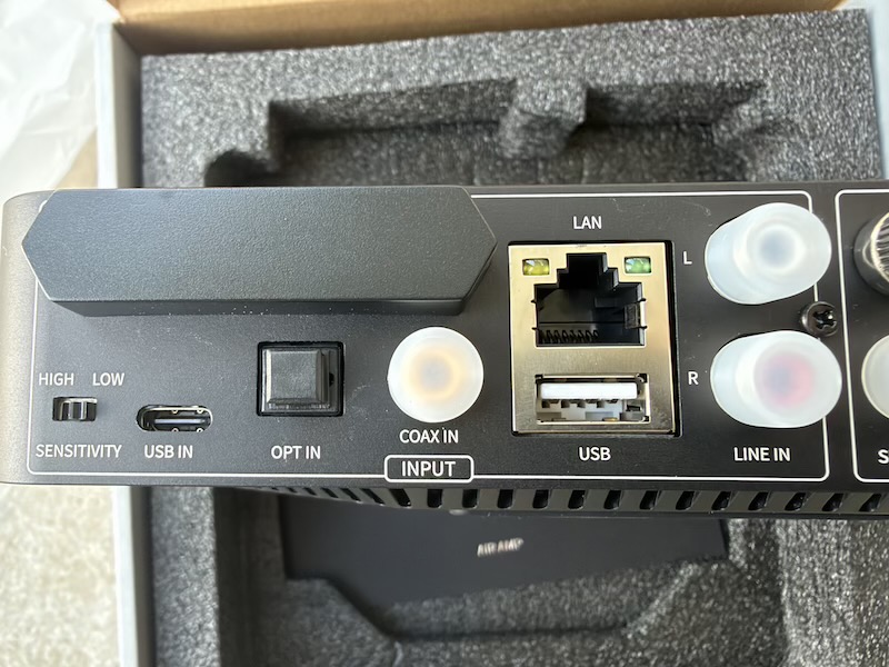 input side of the rear panel: sensitivity switch, usb-c, optical, coaxial, lan, usb-a and rca line in