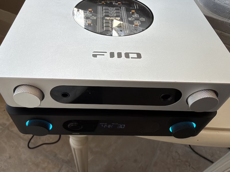 top view of the silver fiio k13 r2r stacked on the air amp