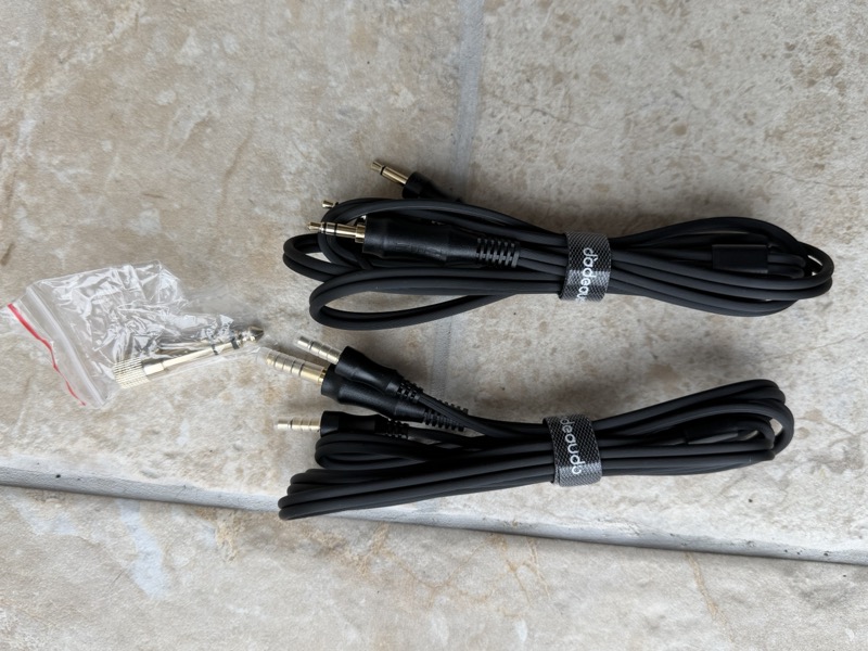 the same two headphone cables with the jt9’s 3.5mm-to-6.35mm screw adapter still in its bag