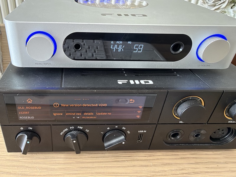 the original k17 showing a new firmware version detected prompt for v249, with the silver k13 r2r stacked on top of it